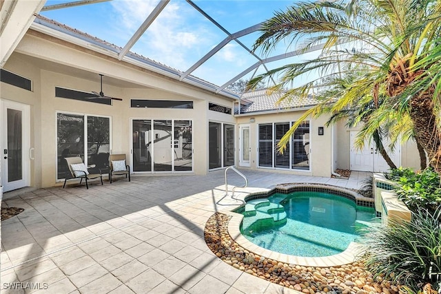 view of swimming pool featuring ceiling fan and a patio