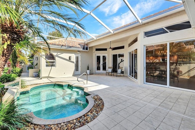 view of swimming pool featuring french doors, ceiling fan, and a patio