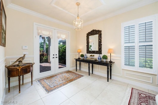 entryway featuring ornamental molding, french doors, light tile patterned flooring, and plenty of natural light