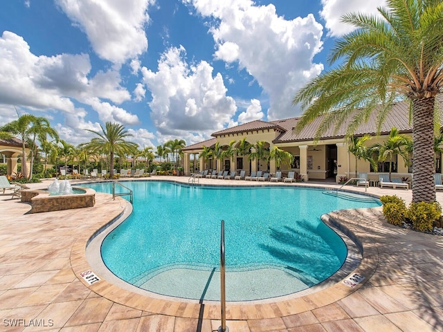 view of swimming pool featuring a patio area