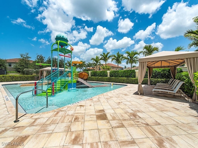 view of pool with a gazebo, a playground, a water slide, and a patio