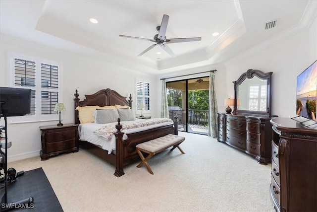 carpeted bedroom with ceiling fan, access to outside, crown molding, and a tray ceiling