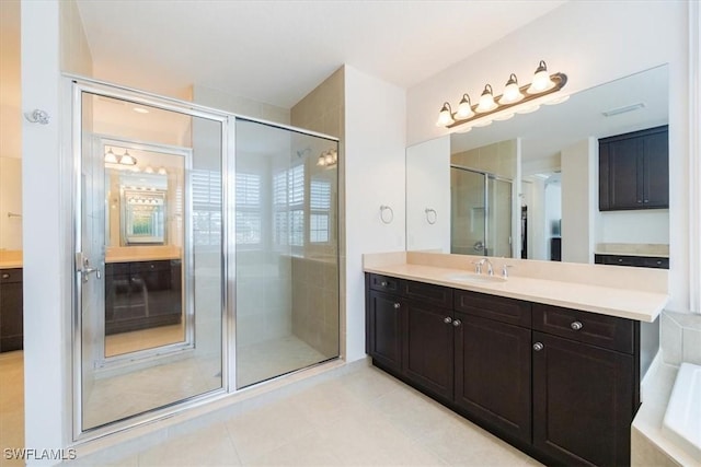 bathroom with vanity, tile patterned flooring, and independent shower and bath