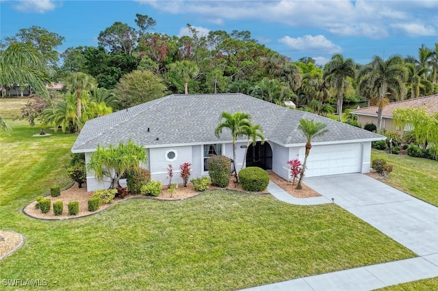 ranch-style house featuring a front yard and a garage