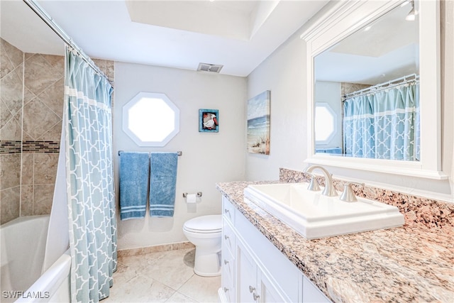 full bathroom featuring tile patterned floors, toilet, vanity, and shower / bath combination with curtain