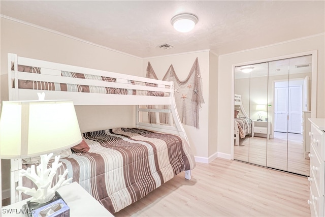 bedroom with a closet and light wood-type flooring