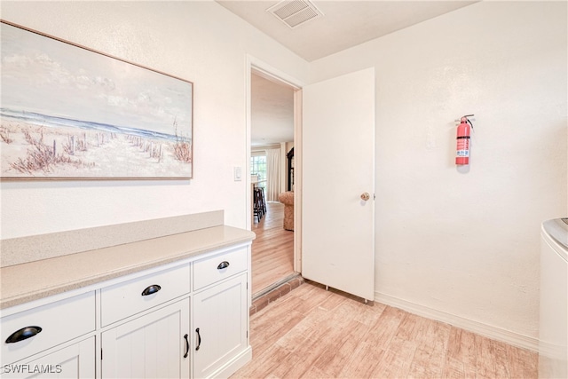 hallway featuring light hardwood / wood-style flooring