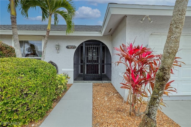 entrance to property featuring a garage