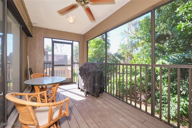 sunroom / solarium with ceiling fan