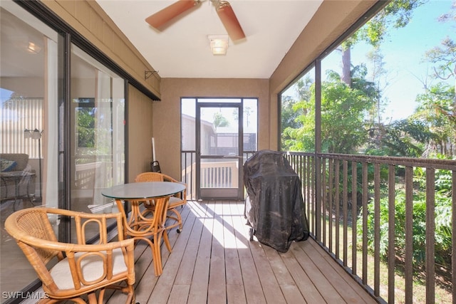 sunroom / solarium with ceiling fan