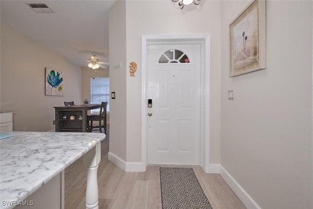 entrance foyer with ceiling fan and light wood-type flooring