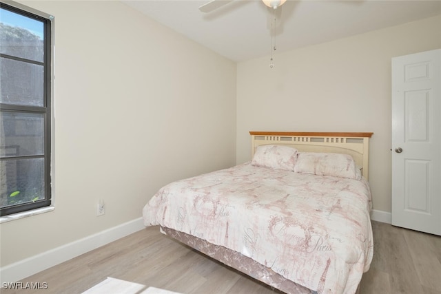 bedroom featuring ceiling fan and light hardwood / wood-style flooring