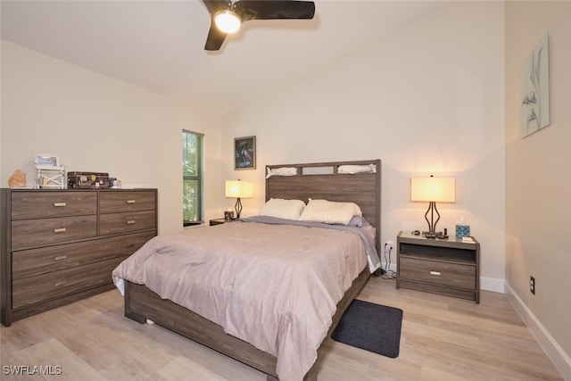 bedroom featuring ceiling fan, vaulted ceiling, and light hardwood / wood-style floors