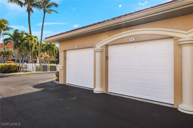 garage featuring fence