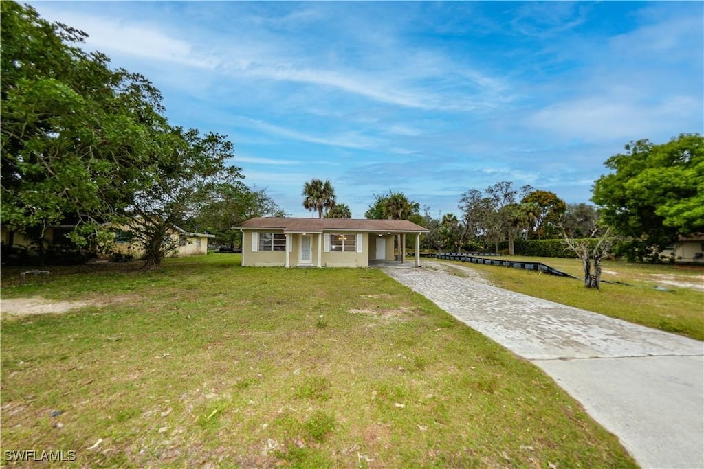 single story home with a front yard