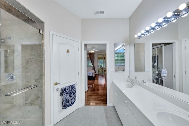 bathroom featuring vanity, tile patterned floors, and an enclosed shower