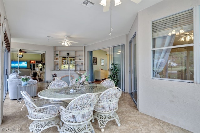 dining room featuring ceiling fan and light tile patterned flooring