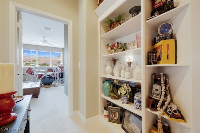 interior space featuring carpet and baseboards