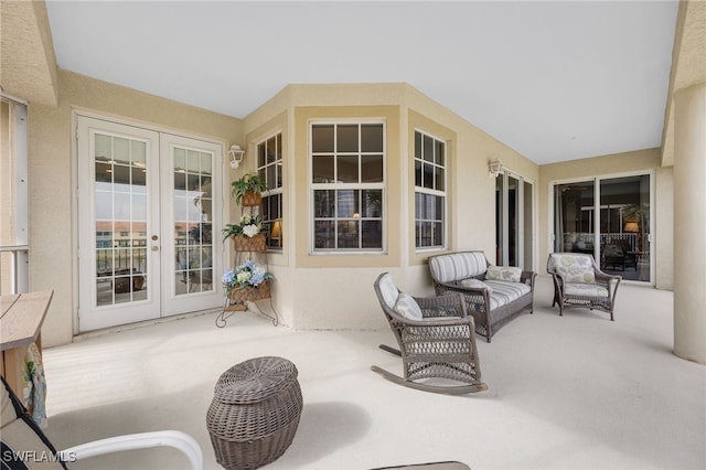 sunroom featuring french doors