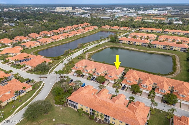 bird's eye view featuring a water view and a residential view