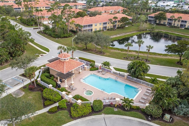 birds eye view of property featuring a residential view and a water view