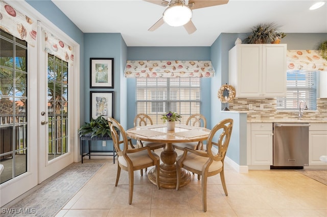 dining room with french doors, light tile patterned flooring, and ceiling fan