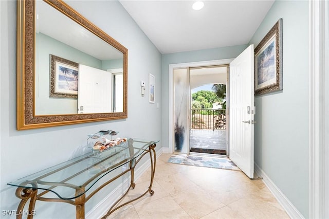 doorway featuring light tile patterned flooring