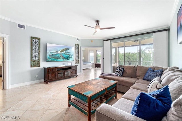 living room featuring light tile patterned flooring, ornamental molding, and ceiling fan