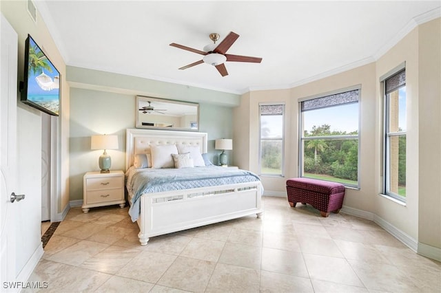 tiled bedroom featuring multiple windows, ceiling fan, and crown molding