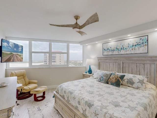 bedroom with light wood-type flooring and ceiling fan