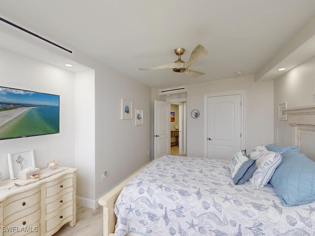 bedroom featuring ceiling fan and light hardwood / wood-style flooring