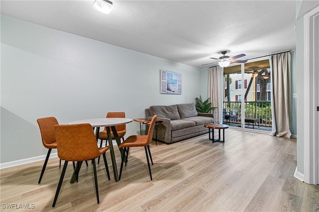 dining space featuring ceiling fan and light hardwood / wood-style floors