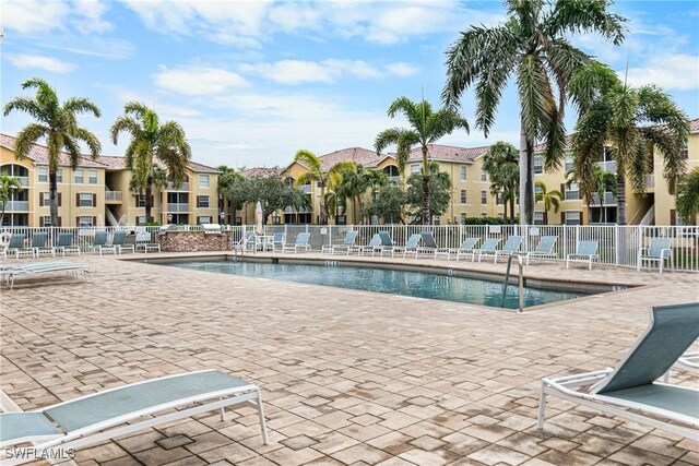 view of swimming pool featuring a patio area