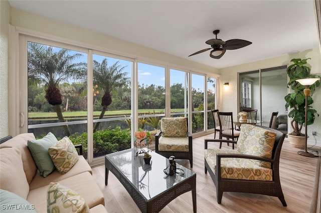 sunroom with plenty of natural light and ceiling fan