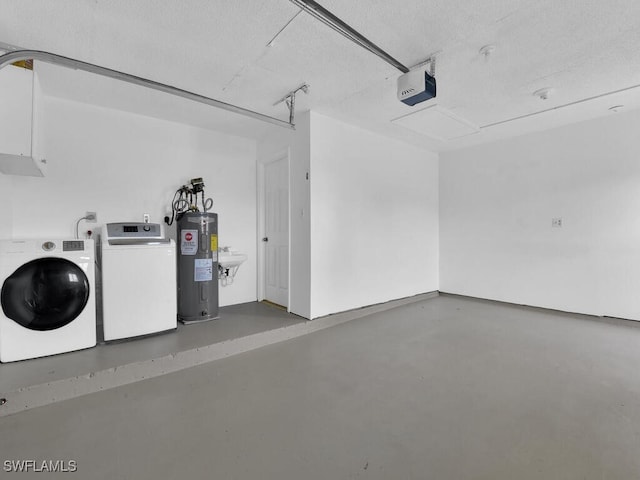 garage featuring a garage door opener, water heater, and washer and clothes dryer