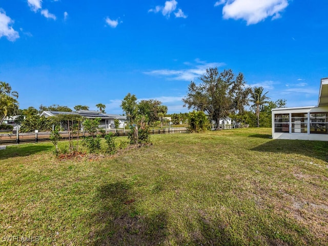 view of yard with a sunroom