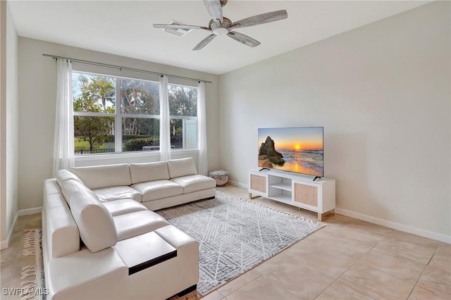 tiled living room featuring ceiling fan