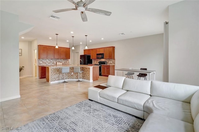 tiled living room featuring ceiling fan