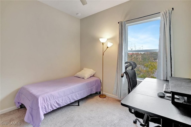 bedroom with ceiling fan and light colored carpet