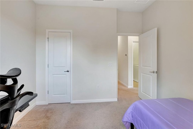 bedroom featuring light carpet