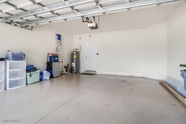 garage featuring a garage door opener and water heater