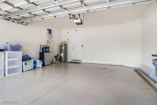 garage featuring water heater and a garage door opener