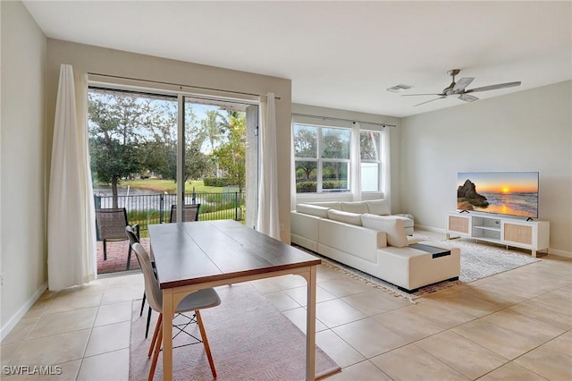 tiled living room featuring ceiling fan