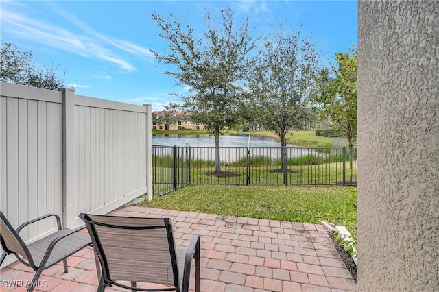 view of patio / terrace with a water view