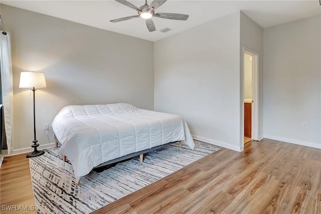 bedroom featuring light hardwood / wood-style floors and ceiling fan