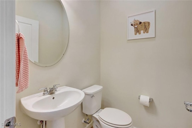 bathroom with sink and toilet