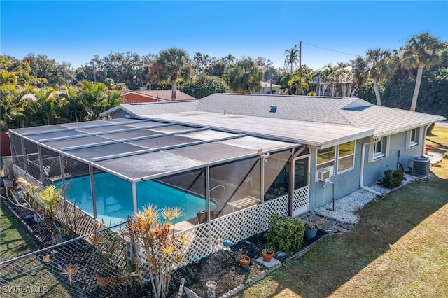 exterior space with a lawn, central AC, and a lanai