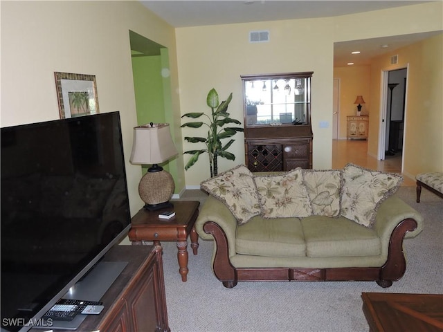 living room featuring light carpet