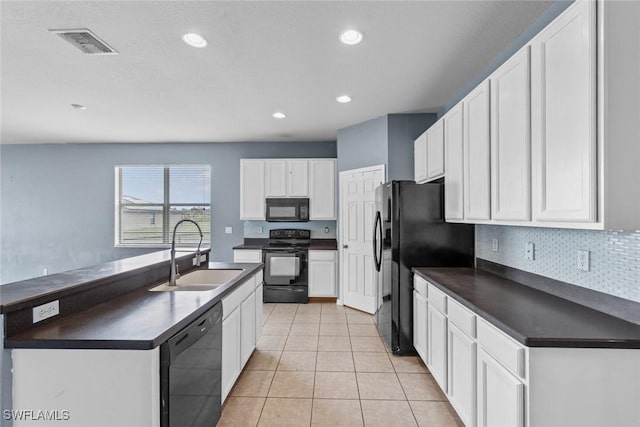 kitchen with black appliances, white cabinetry, sink, and light tile patterned floors