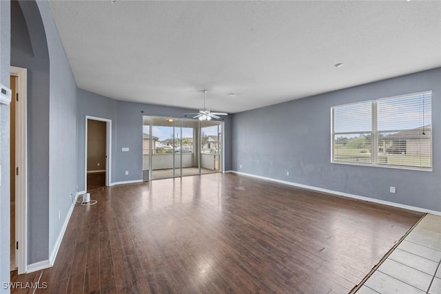 spare room featuring ceiling fan and hardwood / wood-style flooring